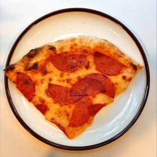 Slice of pepperoni pizza